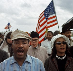 Martin Luther King, Jr. and Coretta Scott King outside Montgomery on the Fourth Day of the March, Alabama Route 80, 1965. Photo:  Bob Adelman. 